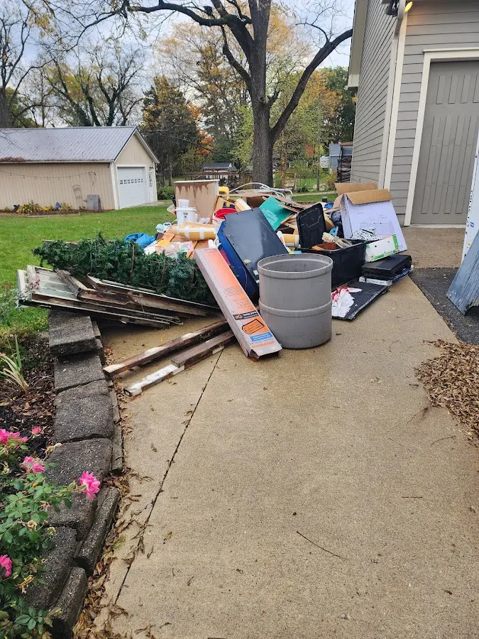 Dumpster being loaded with debris for 10 Yard Dumpster Rental in Park City